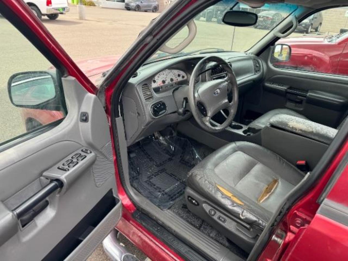 2004 Red Fire Metallic /Medium Dark Flint Cloth Interior Ford Explorer Sport Trac XLT 2WD (1FMZU67K24U) with an 4.0L V6 SOHC 12V FFV engine, 5-Speed Automatic transmission, located at 1865 East Red Hills Pkwy, St. George, 84770, (435) 628-0023, 37.120850, -113.543640 - Photo#9