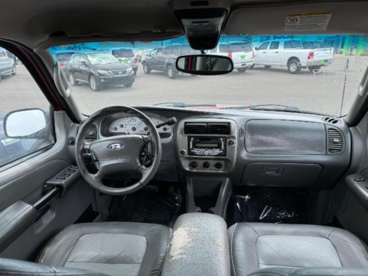 2004 Red Fire Metallic /Medium Dark Flint Cloth Interior Ford Explorer Sport Trac XLT 2WD (1FMZU67K24U) with an 4.0L V6 SOHC 12V FFV engine, 5-Speed Automatic transmission, located at 1865 East Red Hills Pkwy, St. George, 84770, (435) 628-0023, 37.120850, -113.543640 - Photo#12