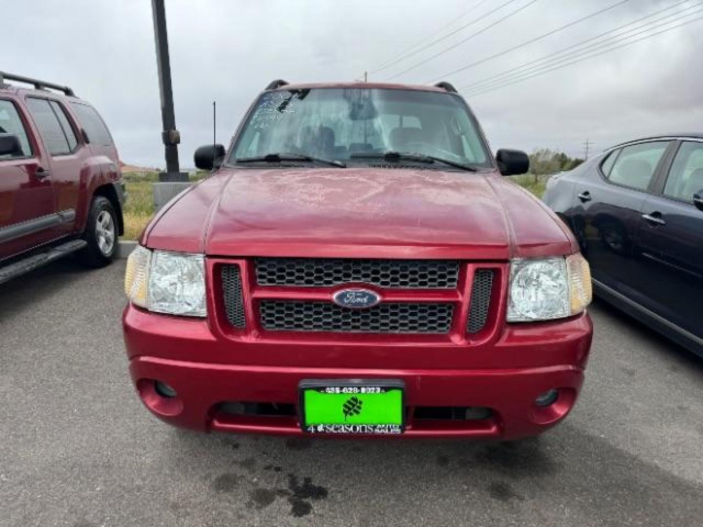 2004 Red Fire Metallic /Medium Dark Flint Cloth Interior Ford Explorer Sport Trac XLT 2WD (1FMZU67K24U) with an 4.0L V6 SOHC 12V FFV engine, 5-Speed Automatic transmission, located at 1865 East Red Hills Pkwy, St. George, 84770, (435) 628-0023, 37.120850, -113.543640 - Photo#1