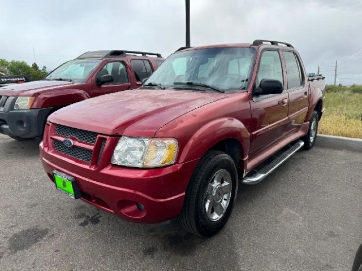 2004 Red Fire Metallic /Medium Dark Flint Cloth Interior Ford Explorer Sport Trac XLT 2WD (1FMZU67K24U) with an 4.0L V6 SOHC 12V FFV engine, 5-Speed Automatic transmission, located at 1865 East Red Hills Pkwy, St. George, 84770, (435) 628-0023, 37.120850, -113.543640 - Photo#2