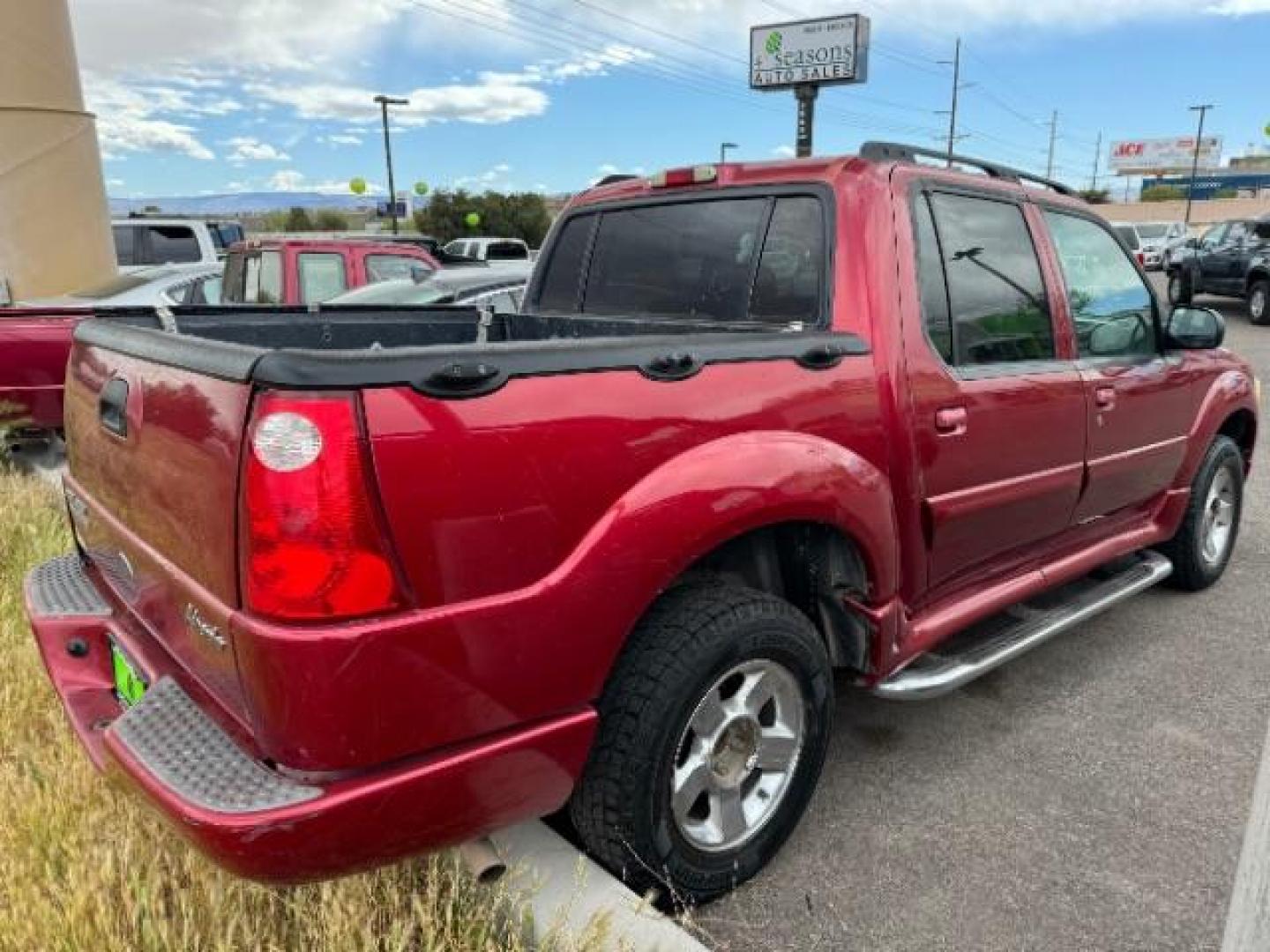 2004 Red Fire Metallic /Medium Dark Flint Cloth Interior Ford Explorer Sport Trac XLT 2WD (1FMZU67K24U) with an 4.0L V6 SOHC 12V FFV engine, 5-Speed Automatic transmission, located at 1865 East Red Hills Pkwy, St. George, 84770, (435) 628-0023, 37.120850, -113.543640 - Photo#3