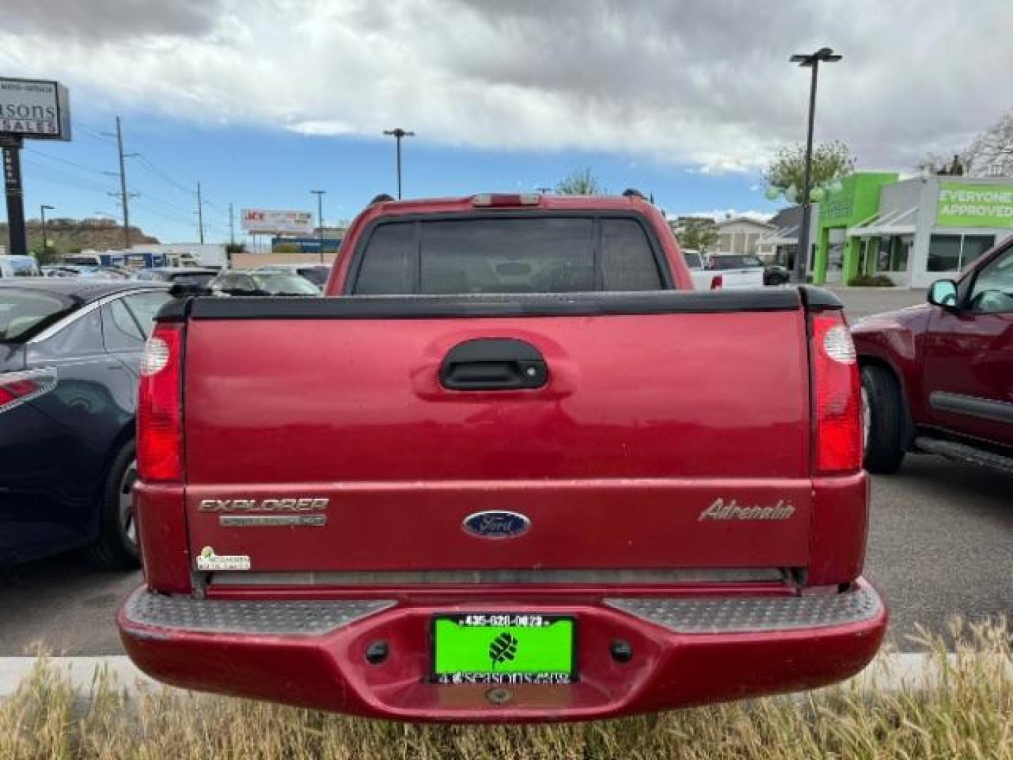 2004 Red Fire Metallic /Medium Dark Flint Cloth Interior Ford Explorer Sport Trac XLT 2WD (1FMZU67K24U) with an 4.0L V6 SOHC 12V FFV engine, 5-Speed Automatic transmission, located at 1865 East Red Hills Pkwy, St. George, 84770, (435) 628-0023, 37.120850, -113.543640 - Photo#4