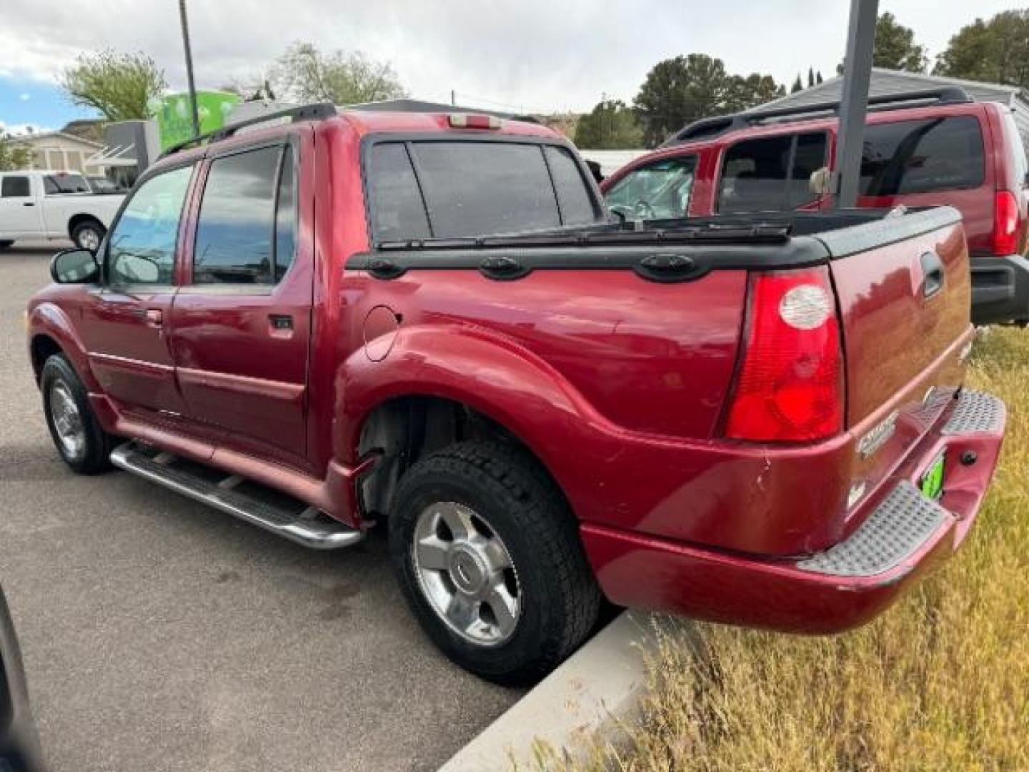 2004 Red Fire Metallic /Medium Dark Flint Cloth Interior Ford Explorer Sport Trac XLT 2WD (1FMZU67K24U) with an 4.0L V6 SOHC 12V FFV engine, 5-Speed Automatic transmission, located at 1865 East Red Hills Pkwy, St. George, 84770, (435) 628-0023, 37.120850, -113.543640 - Photo#5