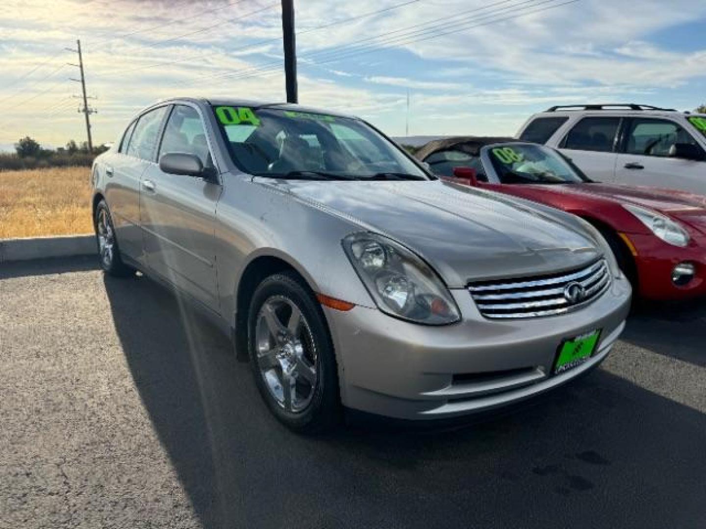 2004 Desert Platinum /Willow Cloth Interio Infiniti G35 Sedan (JNKCV51EX4M) with an 3.5L V6 DOHC 24V engine, 5-Speed Automatic transmission, located at 1865 East Red Hills Pkwy, St. George, 84770, (435) 628-0023, 37.120850, -113.543640 - Photo#0