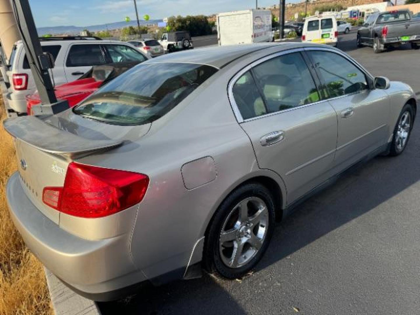 2004 Desert Platinum /Willow Cloth Interio Infiniti G35 Sedan (JNKCV51EX4M) with an 3.5L V6 DOHC 24V engine, 5-Speed Automatic transmission, located at 1865 East Red Hills Pkwy, St. George, 84770, (435) 628-0023, 37.120850, -113.543640 - Photo#3