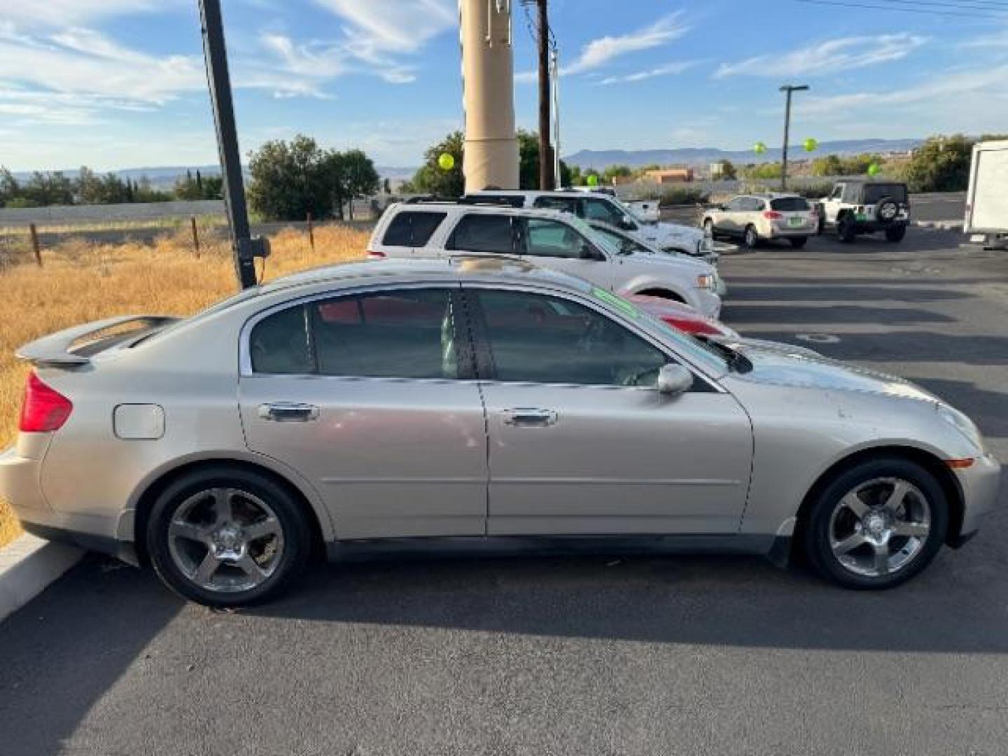 2004 Desert Platinum /Willow Cloth Interio Infiniti G35 Sedan (JNKCV51EX4M) with an 3.5L V6 DOHC 24V engine, 5-Speed Automatic transmission, located at 1865 East Red Hills Pkwy, St. George, 84770, (435) 628-0023, 37.120850, -113.543640 - Photo#4