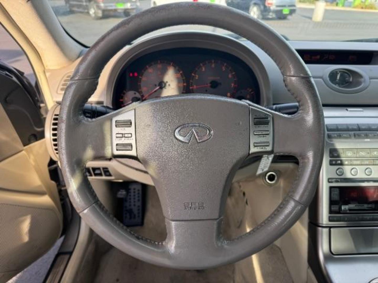 2004 Desert Platinum /Willow Cloth Interio Infiniti G35 Sedan (JNKCV51EX4M) with an 3.5L V6 DOHC 24V engine, 5-Speed Automatic transmission, located at 1865 East Red Hills Pkwy, St. George, 84770, (435) 628-0023, 37.120850, -113.543640 - Photo#5