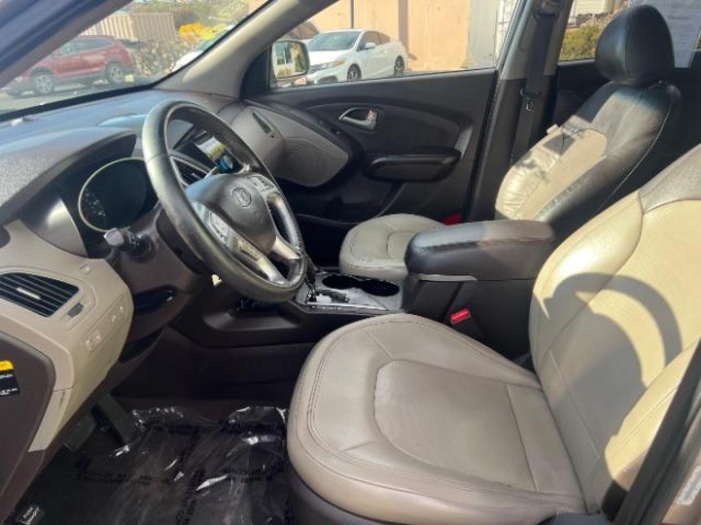 2010 Chai Bronze Metallic /Taupe Leather Interior Hyundai Tucson Limited 2WD (KM8JU3AC8AU) with an 2.4L L4 DOHC 16V engine, 6-Speed Automatic transmission, located at 940 North Main Street, Cedar City, UT, 84720, (435) 628-0023, 37.692936, -113.061897 - We specialize in helping ALL people get the best financing available. No matter your credit score, good, bad or none we can get you an amazing rate. Had a bankruptcy, divorce, or repossessions? We give you the green light to get your credit back on the road. Low down and affordable payments that fit - Photo#12