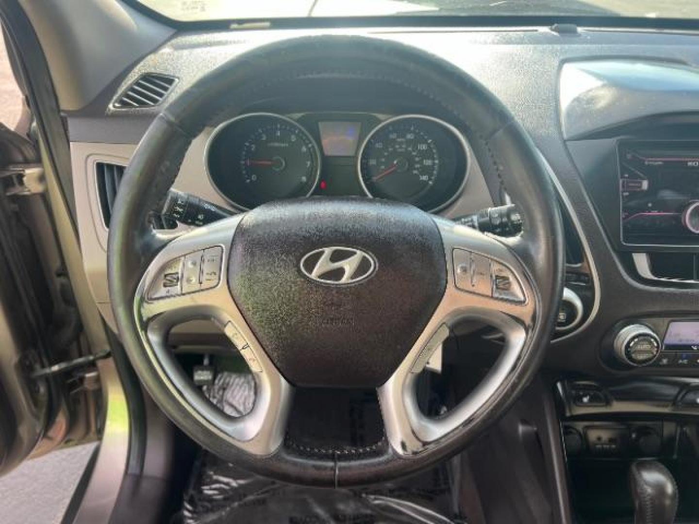 2010 Chai Bronze Metallic /Taupe Leather Interior Hyundai Tucson Limited 2WD (KM8JU3AC8AU) with an 2.4L L4 DOHC 16V engine, 6-Speed Automatic transmission, located at 940 North Main Street, Cedar City, UT, 84720, (435) 628-0023, 37.692936, -113.061897 - We specialize in helping ALL people get the best financing available. No matter your credit score, good, bad or none we can get you an amazing rate. Had a bankruptcy, divorce, or repossessions? We give you the green light to get your credit back on the road. Low down and affordable payments that fit - Photo#16