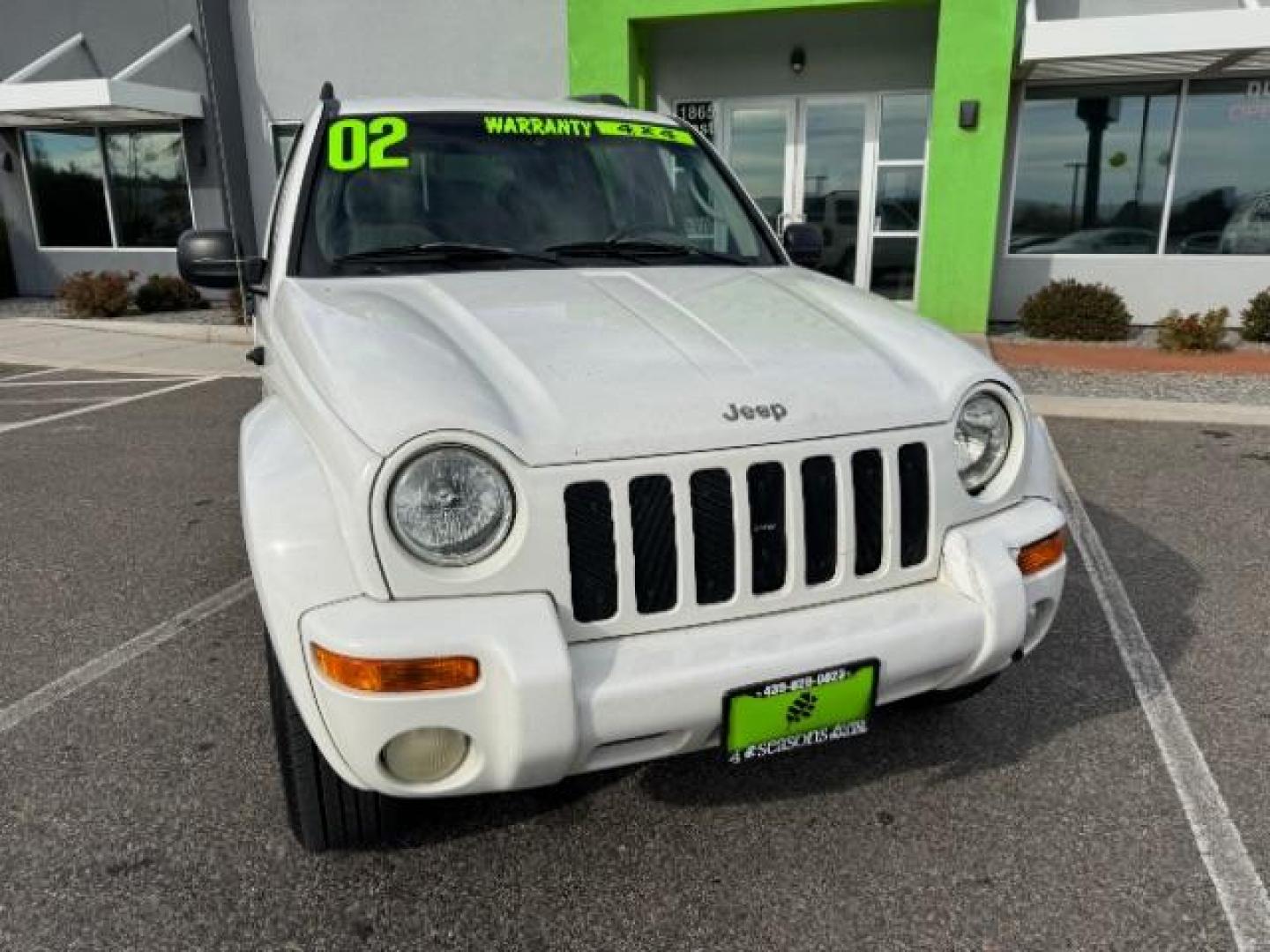 2002 Stone White /Dark Slate Gray Clot Jeep Liberty Limited 4WD (1J4GL58K62W) with an 3.7L V6 SOHC 12V engine, 4-Speed Automatic transmission, located at 1865 East Red Hills Pkwy, St. George, 84770, (435) 628-0023, 37.120850, -113.543640 - Photo#1