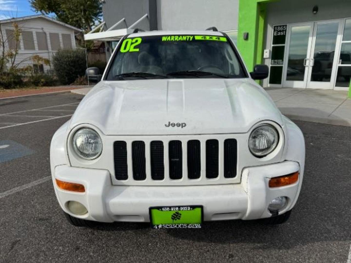 2002 Stone White /Dark Slate Gray Clot Jeep Liberty Limited 4WD (1J4GL58K62W) with an 3.7L V6 SOHC 12V engine, 4-Speed Automatic transmission, located at 1865 East Red Hills Pkwy, St. George, 84770, (435) 628-0023, 37.120850, -113.543640 - Photo#2