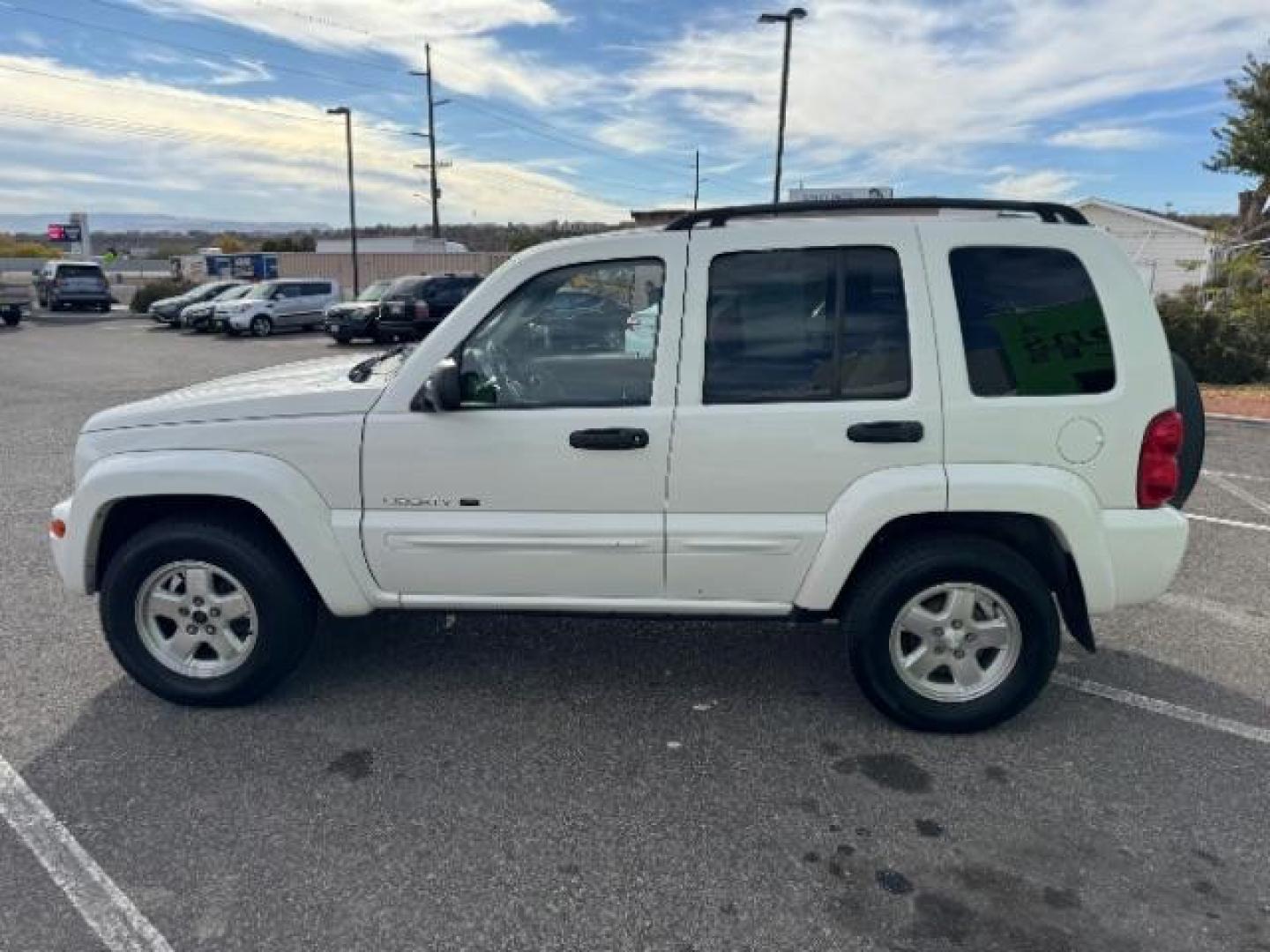 2002 Stone White /Dark Slate Gray Clot Jeep Liberty Limited 4WD (1J4GL58K62W) with an 3.7L V6 SOHC 12V engine, 4-Speed Automatic transmission, located at 1865 East Red Hills Pkwy, St. George, 84770, (435) 628-0023, 37.120850, -113.543640 - Photo#5