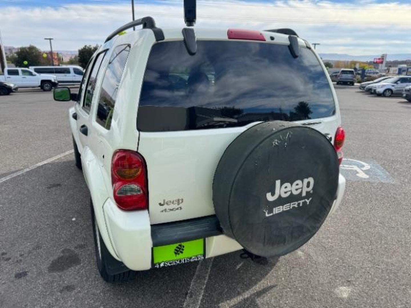 2002 Stone White /Dark Slate Gray Clot Jeep Liberty Limited 4WD (1J4GL58K62W) with an 3.7L V6 SOHC 12V engine, 4-Speed Automatic transmission, located at 1865 East Red Hills Pkwy, St. George, 84770, (435) 628-0023, 37.120850, -113.543640 - Photo#7