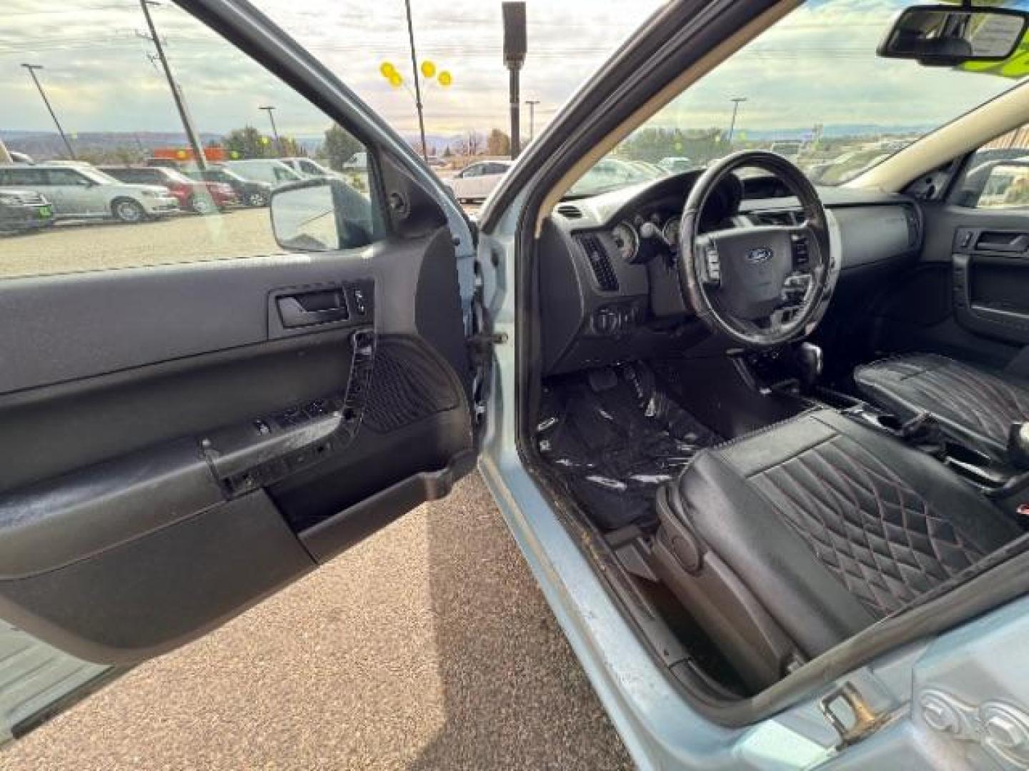 2009 Light Ice Blue Metal /Charcoal Black Cloth Ford Focus SE Sedan (1FAHP35N89W) with an 2.0L L4 DOHC 16V engine, 4-Speed Automatic transmission, located at 1865 East Red Hills Pkwy, St. George, 84770, (435) 628-0023, 37.120850, -113.543640 - We specialize in helping ALL people get the best financing available. No matter your credit score, good, bad or none we can get you an amazing rate. Had a bankruptcy, divorce, or repossessions? We give you the green light to get your credit back on the road. Low down and affordable payments that fit - Photo#16