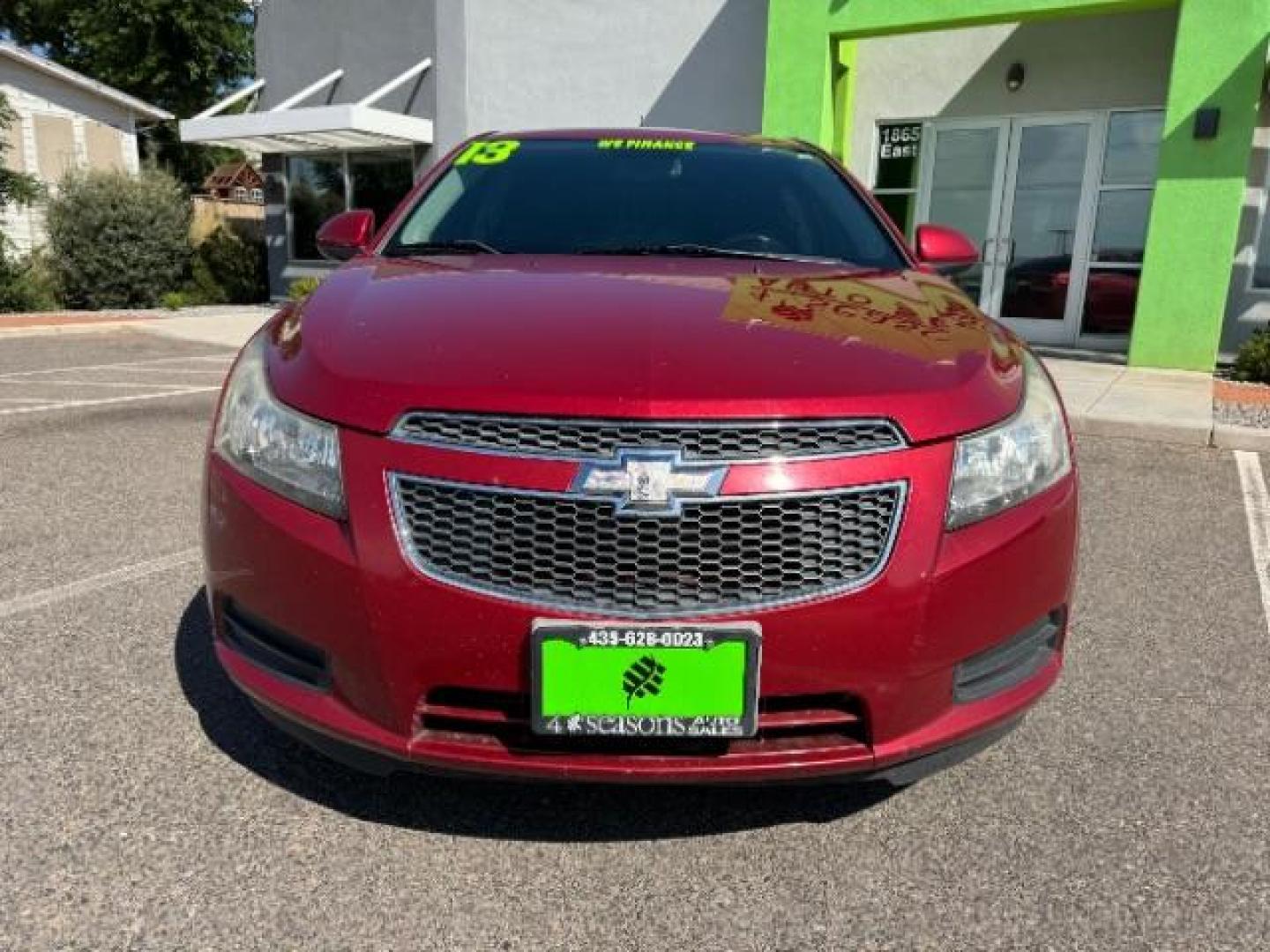 2013 Crystal Red Tintcoat /Jet Black Cloth Inte Chevrolet Cruze 1LT Auto (1G1PC5SB4D7) with an 1.4L L4 DOHC 16V TUR engine, 6-Speed Automatic transmission, located at 940 North Main Street, Cedar City, UT, 84720, (435) 628-0023, 37.692936, -113.061897 - We specialize in helping ALL people get the best financing available. No matter your credit score, good, bad or none we can get you an amazing rate. Had a bankruptcy, divorce, or repossessions? We give you the green light to get your credit back on the road. Low down and affordable payments that fit - Photo#1