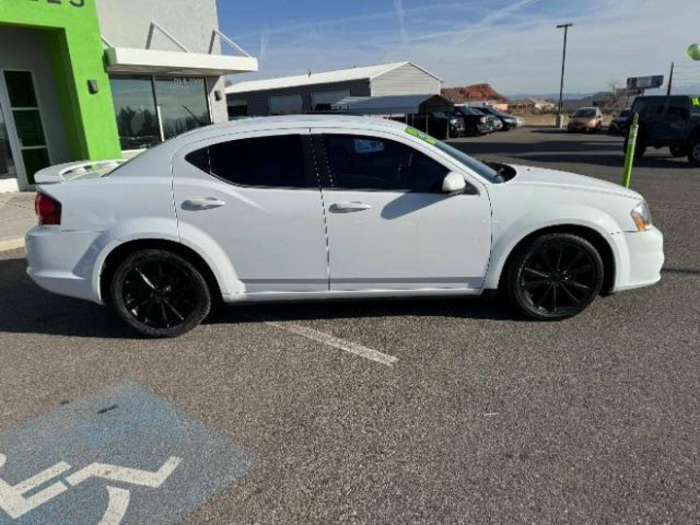 2013 Bright White /Black Cloth Interior Dodge Avenger SXT (1C3CDZCG0DN) with an 3.6L V6 DOHC 24V FFV engine, 6-Speed Automatic transmission, located at 940 North Main Street, Cedar City, UT, 84720, (435) 628-0023, 37.692936, -113.061897 - Photo#11