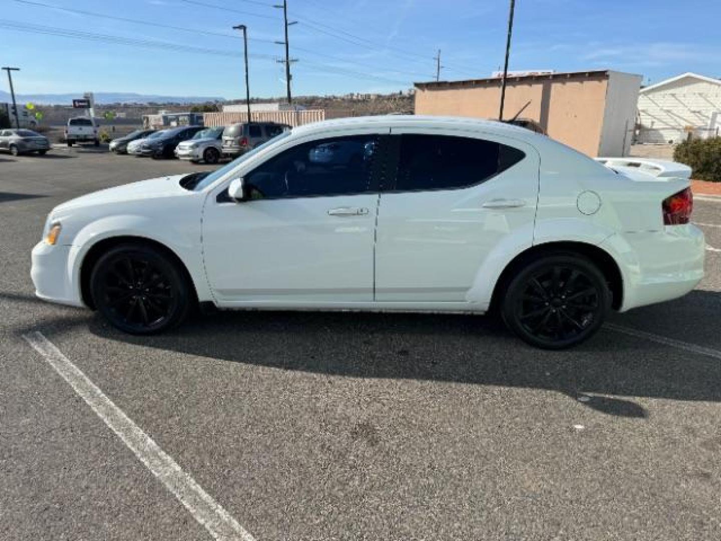 2013 Bright White /Black Cloth Interior Dodge Avenger SXT (1C3CDZCG0DN) with an 3.6L V6 DOHC 24V FFV engine, 6-Speed Automatic transmission, located at 940 North Main Street, Cedar City, UT, 84720, (435) 628-0023, 37.692936, -113.061897 - Photo#5