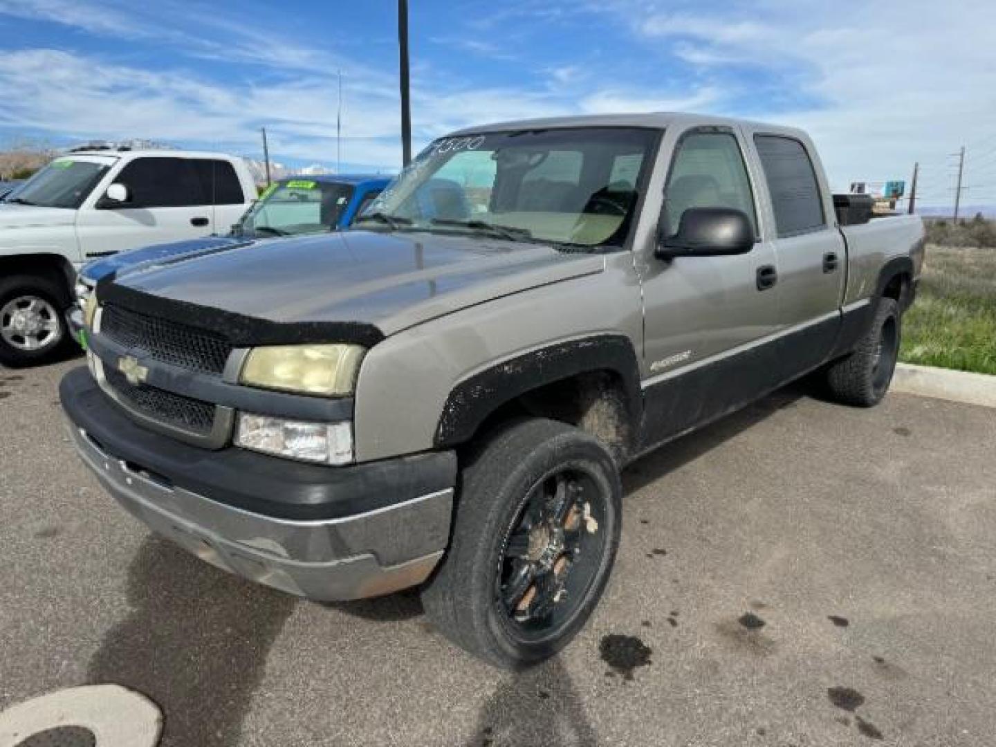 2003 Light Pewter Metalli /Dark Charcoal Cloth Interior Chevrolet Silverado 1500 HD LS Crew Cab 4WD (1GCGK13U03F) with an 6.0L V8 OHV 16V engine, 4-Speed Automatic transmission, located at 1865 East Red Hills Pkwy, St. George, 84770, (435) 628-0023, 37.120850, -113.543640 - This vehicle is a Mechanic Special. This means it will need some love. Runs a drives fine but has body damage, leaks or other mechanical issues. It did NOT pass our 50 point inspection. Get a great deal on a less than perfect car. These cars do NOT qualify for our in house financing. Cash and carry, - Photo#0