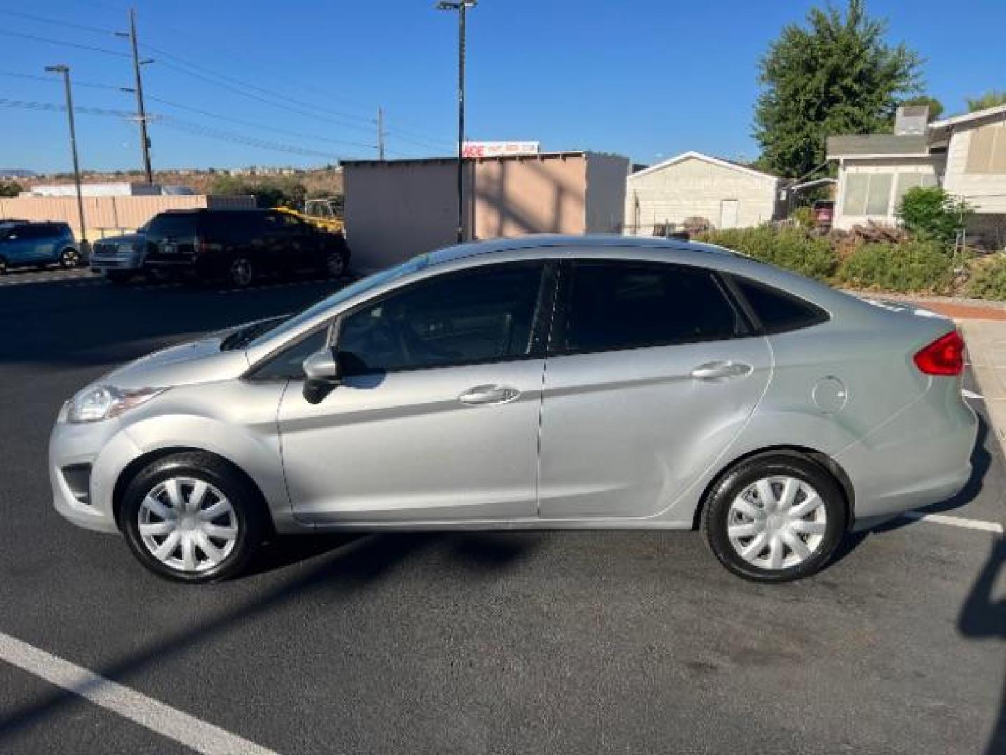 2012 Ingot Silver Metalli /Charcoal Black Cloth Ford Fiesta SE Sedan (3FADP4BJ2CM) with an 1.6L L4 DOHC 16V engine, 6-Speed Automatic transmission, located at 940 North Main Street, Cedar City, UT, 84720, (435) 628-0023, 37.692936, -113.061897 - We specialize in helping ALL people get the best financing available. No matter your credit score, good, bad or none we can get you an amazing rate. Had a bankruptcy, divorce, or repossessions? We give you the green light to get your credit back on the road. Low down and affordable payments that fit - Photo#3