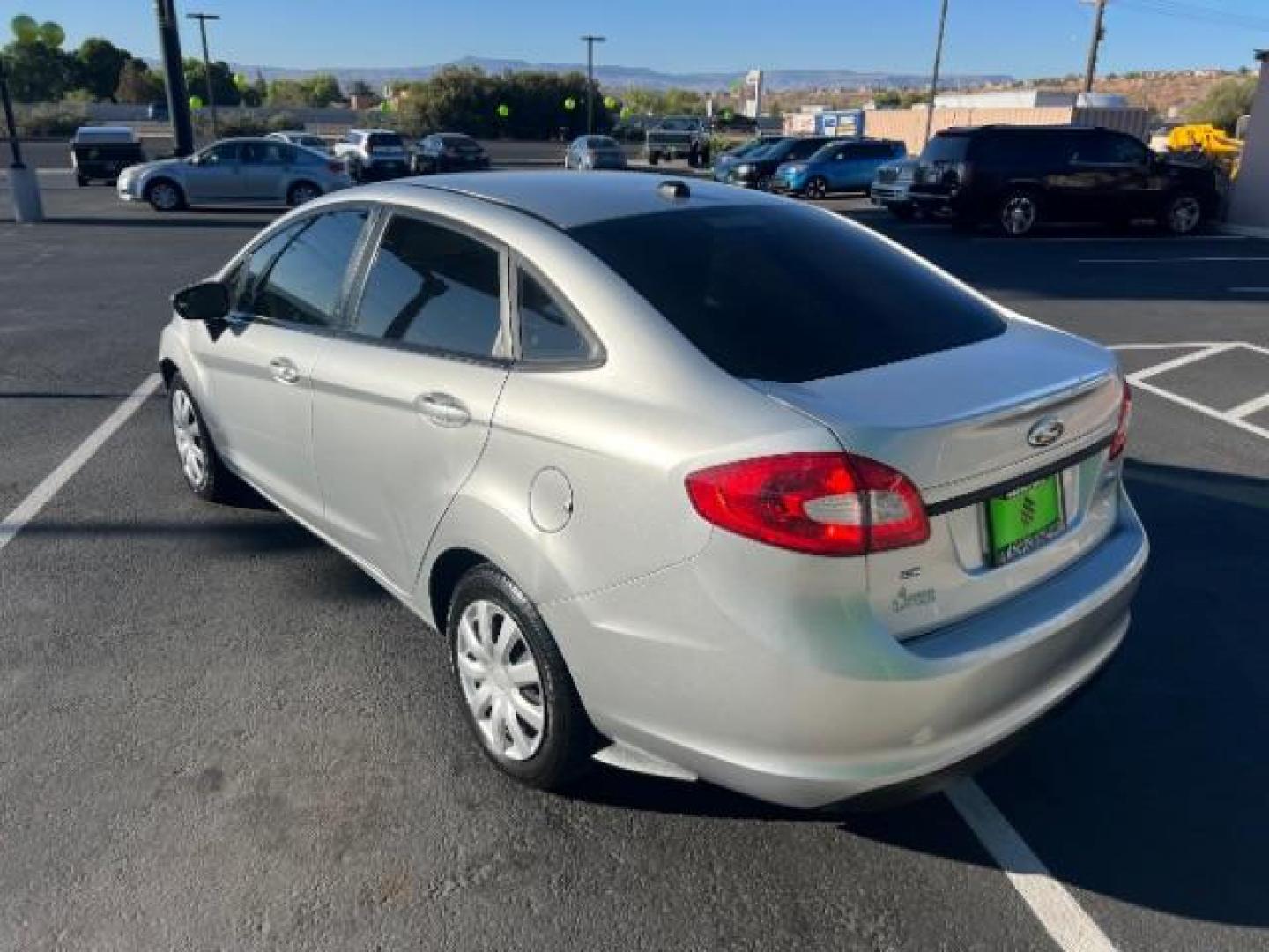 2012 Ingot Silver Metalli /Charcoal Black Cloth Ford Fiesta SE Sedan (3FADP4BJ2CM) with an 1.6L L4 DOHC 16V engine, 6-Speed Automatic transmission, located at 940 North Main Street, Cedar City, UT, 84720, (435) 628-0023, 37.692936, -113.061897 - We specialize in helping ALL people get the best financing available. No matter your credit score, good, bad or none we can get you an amazing rate. Had a bankruptcy, divorce, or repossessions? We give you the green light to get your credit back on the road. Low down and affordable payments that fit - Photo#4