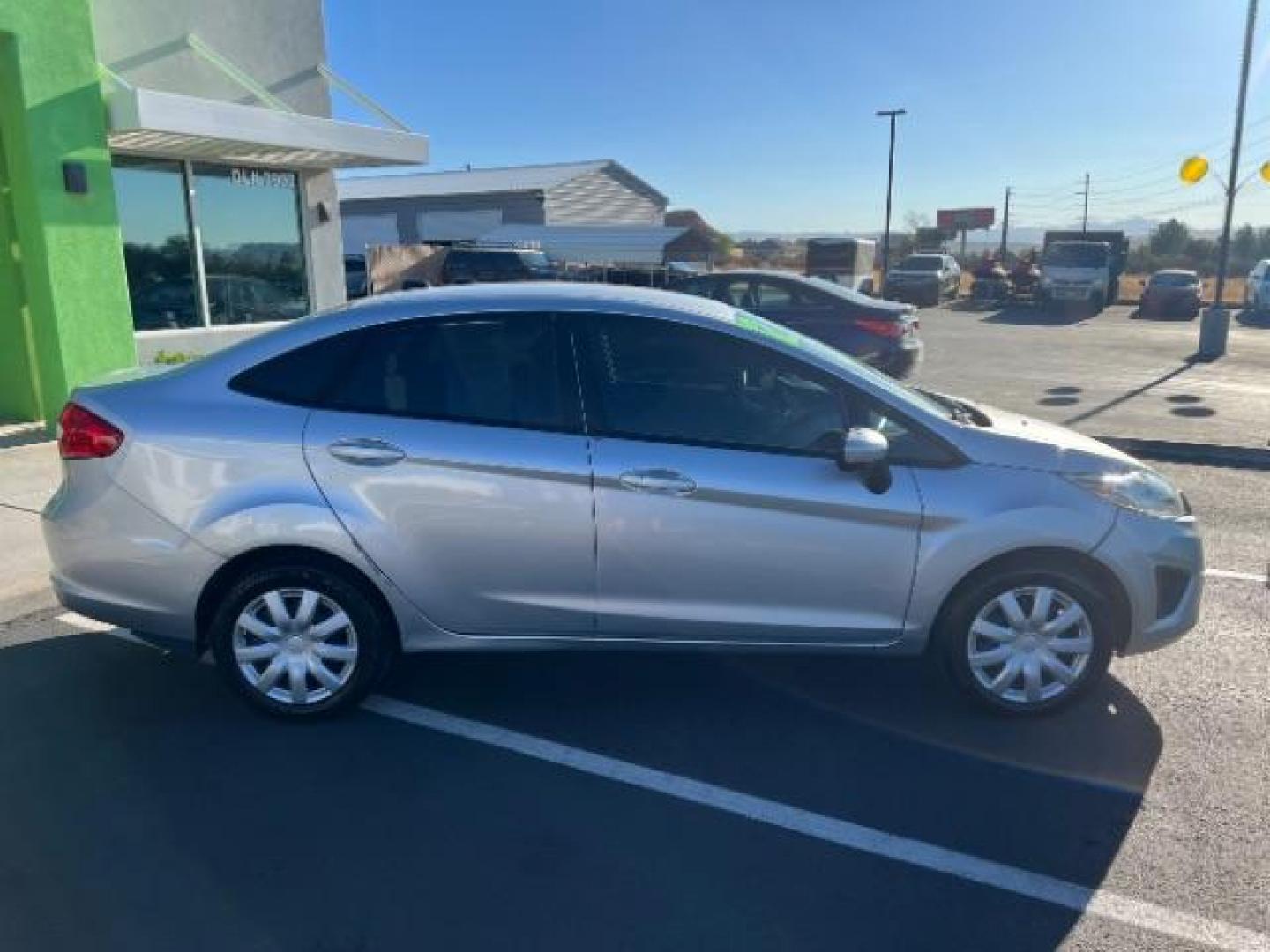 2012 Ingot Silver Metalli /Charcoal Black Cloth Ford Fiesta SE Sedan (3FADP4BJ2CM) with an 1.6L L4 DOHC 16V engine, 6-Speed Automatic transmission, located at 940 North Main Street, Cedar City, UT, 84720, (435) 628-0023, 37.692936, -113.061897 - We specialize in helping ALL people get the best financing available. No matter your credit score, good, bad or none we can get you an amazing rate. Had a bankruptcy, divorce, or repossessions? We give you the green light to get your credit back on the road. Low down and affordable payments that fit - Photo#7