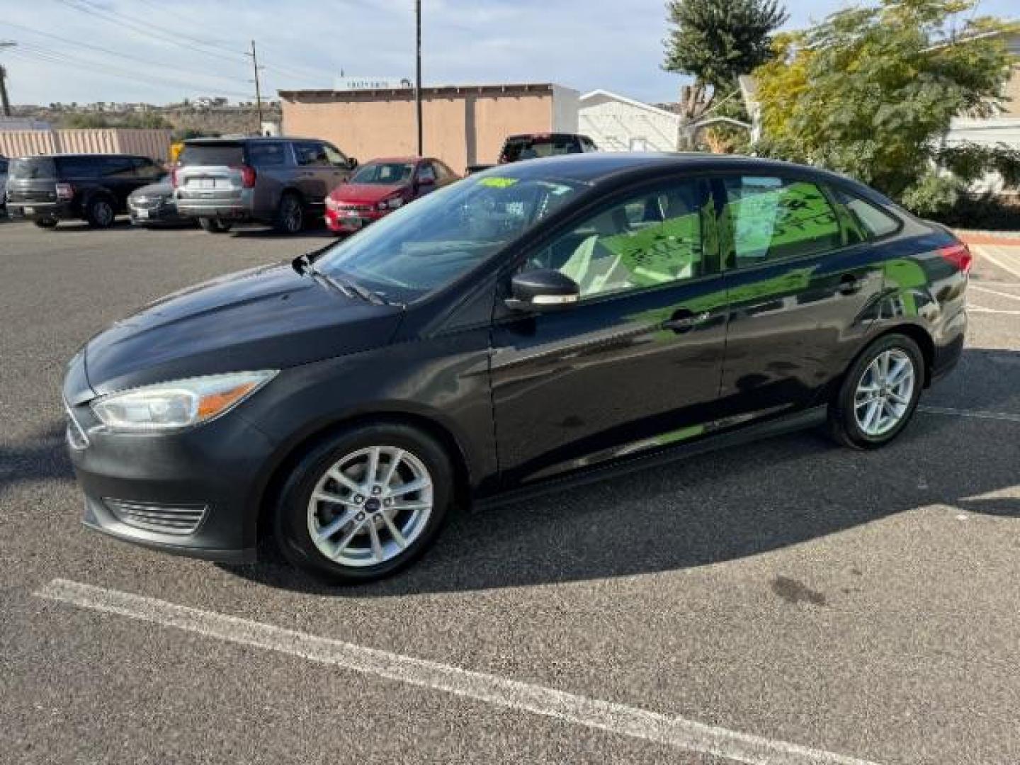 2015 Tuxedo Black Metalli /Charcoal Black Inser Ford Focus SE Sedan (1FADP3F21FL) with an 2.0L L4 DOHC 16V engine, 6-Speed Automatic transmission, located at 940 North Main Street, Cedar City, UT, 84720, (435) 628-0023, 37.692936, -113.061897 - Photo#4