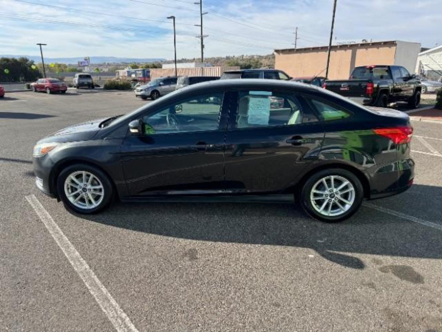 2015 Tuxedo Black Metalli /Charcoal Black Inser Ford Focus SE Sedan (1FADP3F21FL) with an 2.0L L4 DOHC 16V engine, 6-Speed Automatic transmission, located at 940 North Main Street, Cedar City, UT, 84720, (435) 628-0023, 37.692936, -113.061897 - Photo#5