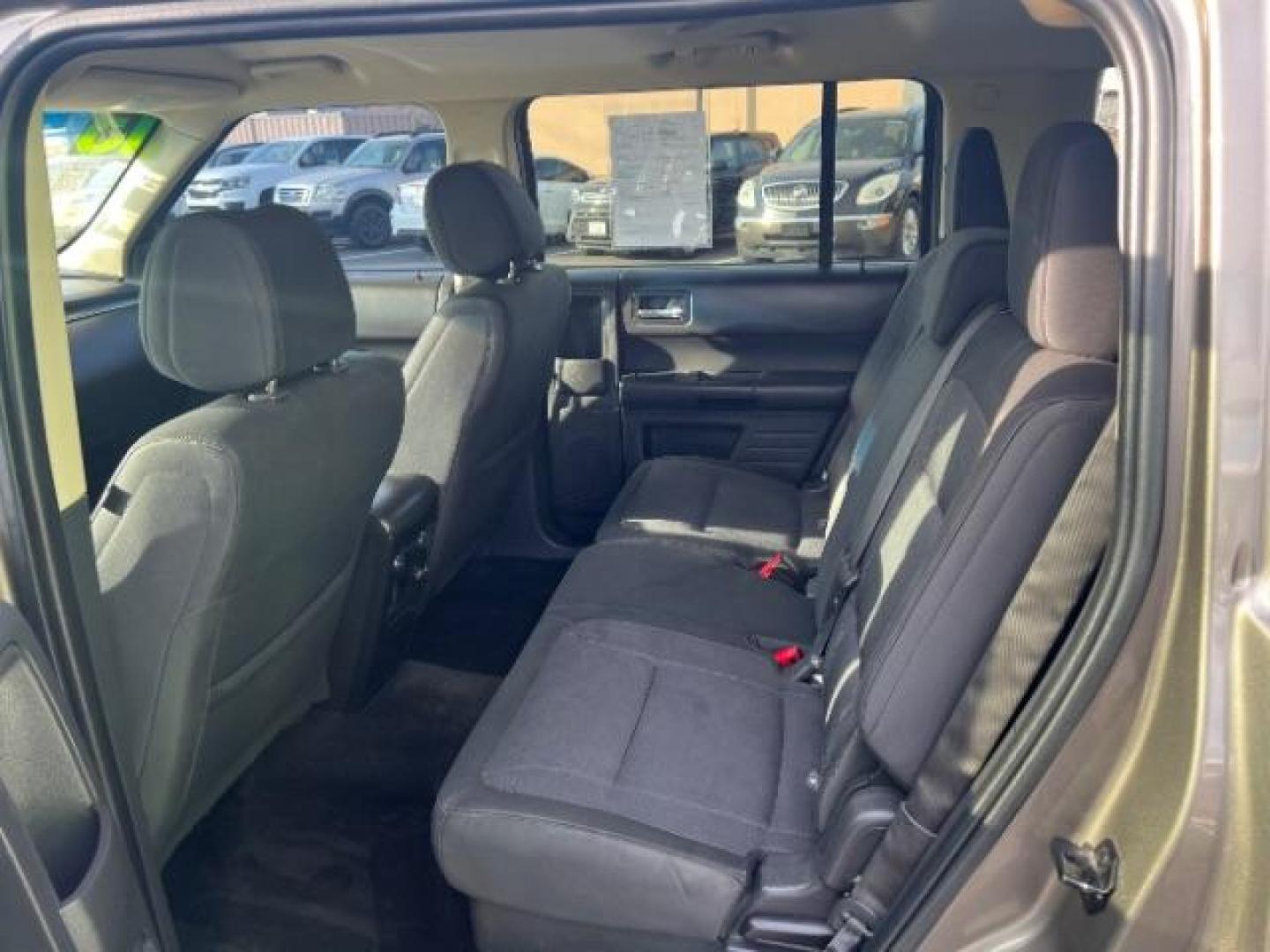 2013 Mineral Gray Metallic /Charcoal Black Cloth Ford Flex SE FWD (2FMGK5B89DB) with an 3.5L V6 DOHC 24V engine, 6-Speed Automatic Ov transmission, located at 1865 East Red Hills Pkwy, St. George, 84770, (435) 628-0023, 37.120850, -113.543640 - We specialize in helping ALL people get the best financing available. No matter your credit score, good, bad or none we can get you an amazing rate. Had a bankruptcy, divorce, or repossessions? We give you the green light to get your credit back on the road. Low down and affordable payments that fit - Photo#22