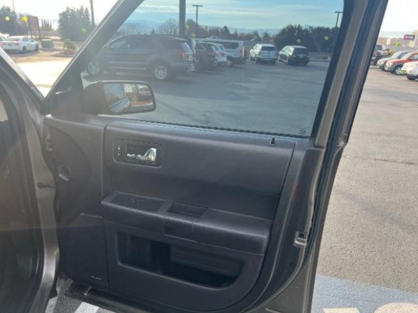 2013 Mineral Gray Metallic /Charcoal Black Cloth Ford Flex SE FWD (2FMGK5B89DB) with an 3.5L V6 DOHC 24V engine, 6-Speed Automatic Ov transmission, located at 1865 East Red Hills Pkwy, St. George, 84770, (435) 628-0023, 37.120850, -113.543640 - We specialize in helping ALL people get the best financing available. No matter your credit score, good, bad or none we can get you an amazing rate. Had a bankruptcy, divorce, or repossessions? We give you the green light to get your credit back on the road. Low down and affordable payments that fit - Photo#28