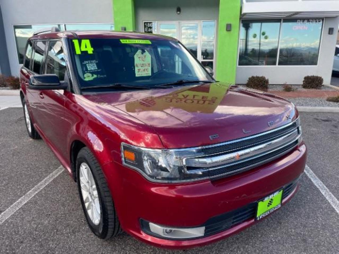 2014 Ruby Red Met Tinted /Charcoal Black Ford Flex SEL FWD (2FMGK5C81EB) with an 3.5L V6 DOHC 24V engine, 6-Speed Automatic Ov transmission, located at 1865 East Red Hills Pkwy, St. George, 84770, (435) 628-0023, 37.120850, -113.543640 - We specialize in helping ALL people get the best financing available. No matter your credit score, good, bad or none we can get you an amazing rate. Had a bankruptcy, divorce, or repossessions? We give you the green light to get your credit back on the road. Low down and affordable payments that fit - Photo#1