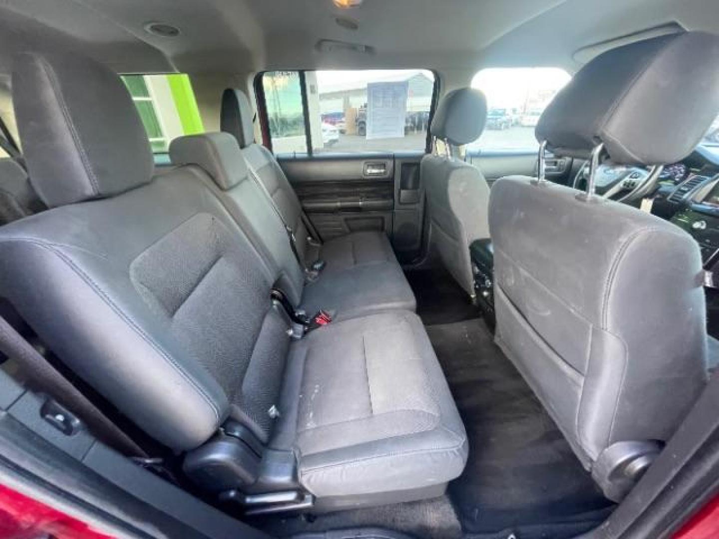 2014 Ruby Red Met Tinted /Charcoal Black Ford Flex SEL FWD (2FMGK5C81EB) with an 3.5L V6 DOHC 24V engine, 6-Speed Automatic Ov transmission, located at 1865 East Red Hills Pkwy, St. George, 84770, (435) 628-0023, 37.120850, -113.543640 - We specialize in helping ALL people get the best financing available. No matter your credit score, good, bad or none we can get you an amazing rate. Had a bankruptcy, divorce, or repossessions? We give you the green light to get your credit back on the road. Low down and affordable payments that fit - Photo#32