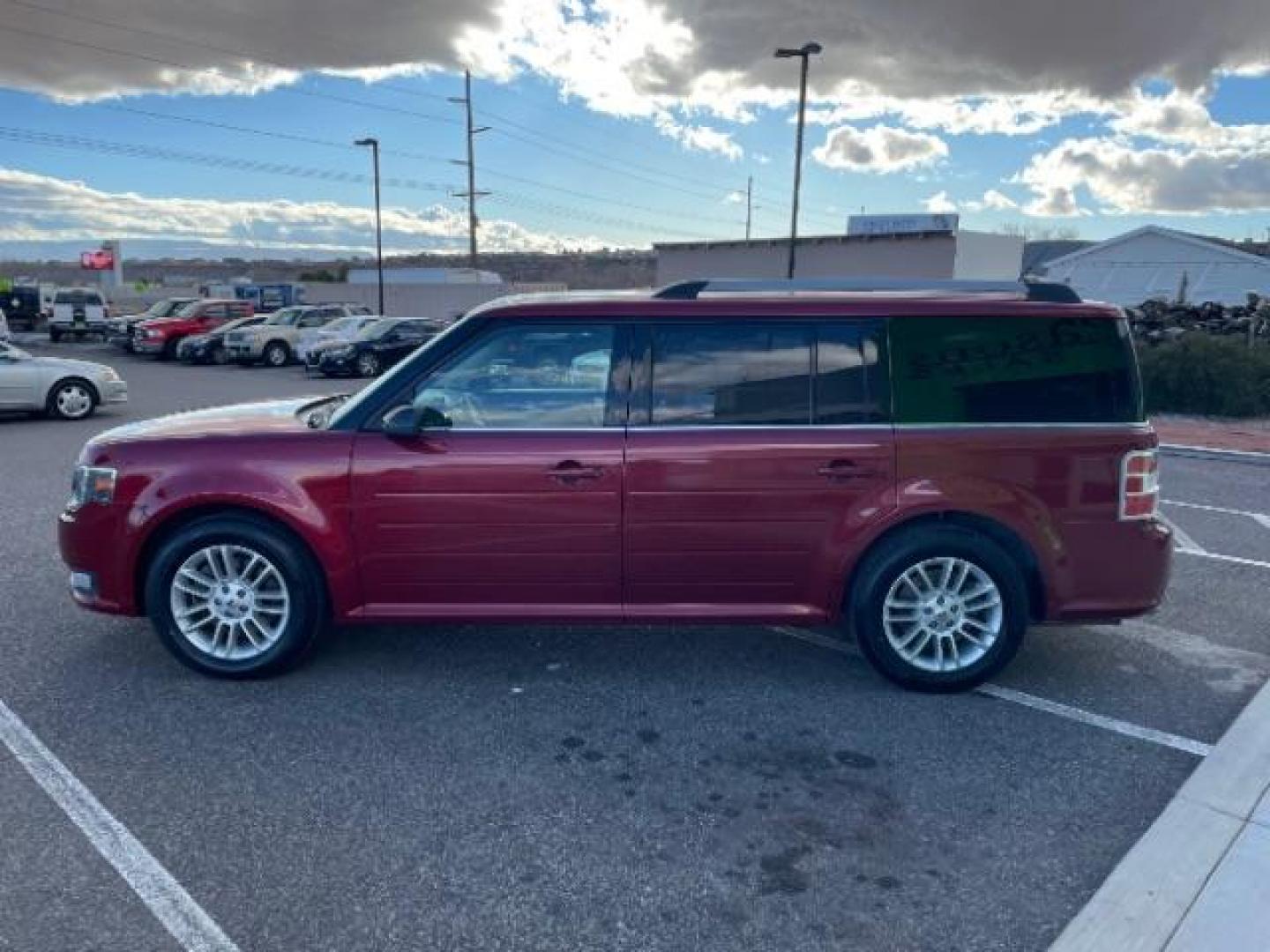 2014 Ruby Red Met Tinted /Charcoal Black Ford Flex SEL FWD (2FMGK5C81EB) with an 3.5L V6 DOHC 24V engine, 6-Speed Automatic Ov transmission, located at 1865 East Red Hills Pkwy, St. George, 84770, (435) 628-0023, 37.120850, -113.543640 - We specialize in helping ALL people get the best financing available. No matter your credit score, good, bad or none we can get you an amazing rate. Had a bankruptcy, divorce, or repossessions? We give you the green light to get your credit back on the road. Low down and affordable payments that fit - Photo#5