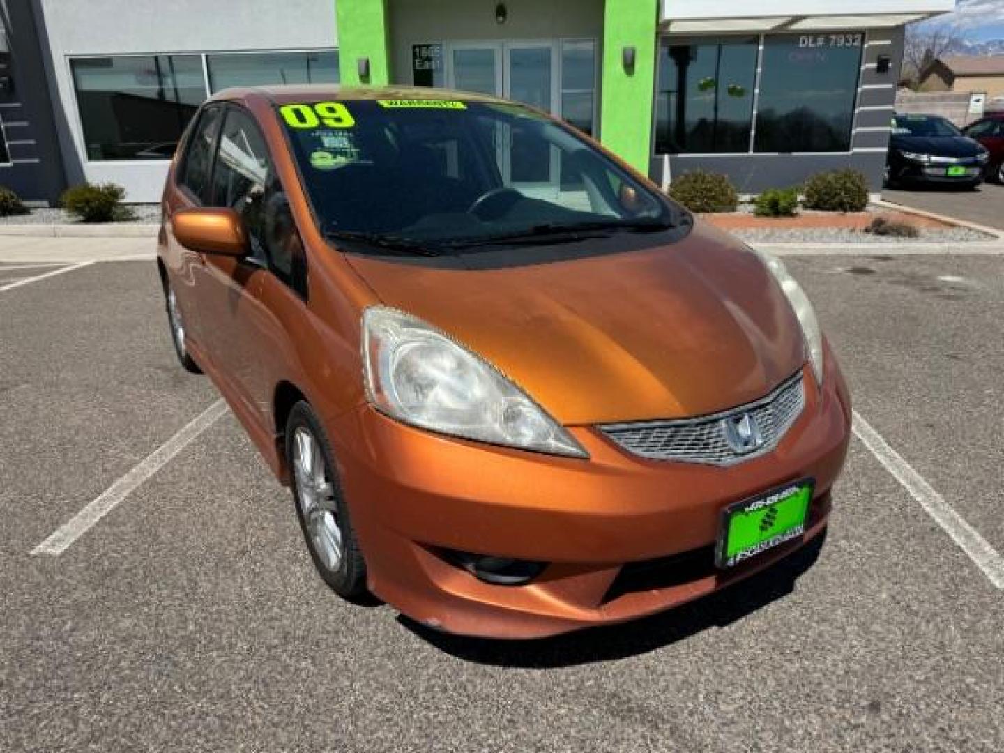 2009 Orange Revolution Me /Black Cloth Interior Honda Fit Sport 5-Speed AT (JHMGE88409S) with an 1.5L L4 SOHC 16V engine, 5-Speed Automatic transmission, located at 1865 East Red Hills Pkwy, St. George, 84770, (435) 628-0023, 37.120850, -113.543640 - Photo#1