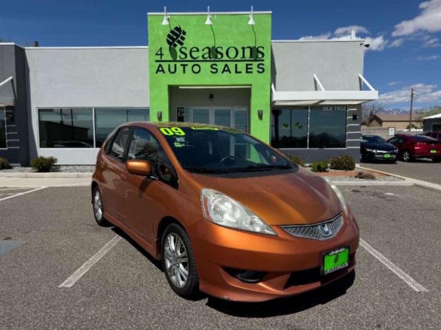 2009 Orange Revolution Me /Black Cloth Interior Honda Fit Sport 5-Speed AT (JHMGE88409S) with an 1.5L L4 SOHC 16V engine, 5-Speed Automatic transmission, located at 1865 East Red Hills Pkwy, St. George, 84770, (435) 628-0023, 37.120850, -113.543640 - Photo#0