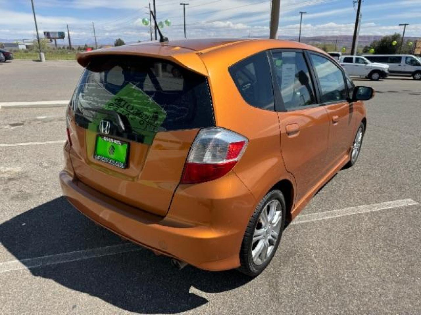 2009 Orange Revolution Me /Black Cloth Interior Honda Fit Sport 5-Speed AT (JHMGE88409S) with an 1.5L L4 SOHC 16V engine, 5-Speed Automatic transmission, located at 1865 East Red Hills Pkwy, St. George, 84770, (435) 628-0023, 37.120850, -113.543640 - Photo#9