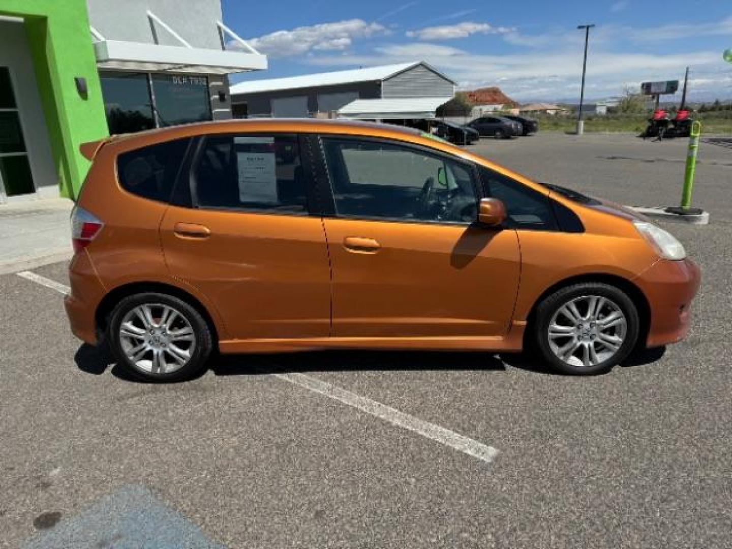 2009 Orange Revolution Me /Black Cloth Interior Honda Fit Sport 5-Speed AT (JHMGE88409S) with an 1.5L L4 SOHC 16V engine, 5-Speed Automatic transmission, located at 1865 East Red Hills Pkwy, St. George, 84770, (435) 628-0023, 37.120850, -113.543640 - Photo#10