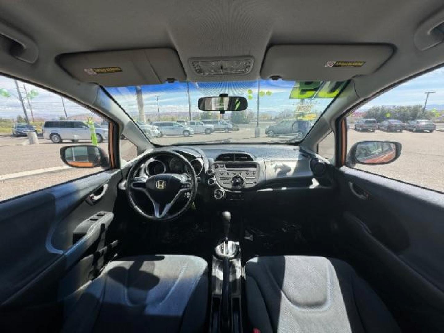 2009 Orange Revolution Me /Black Cloth Interior Honda Fit Sport 5-Speed AT (JHMGE88409S) with an 1.5L L4 SOHC 16V engine, 5-Speed Automatic transmission, located at 1865 East Red Hills Pkwy, St. George, 84770, (435) 628-0023, 37.120850, -113.543640 - Photo#24