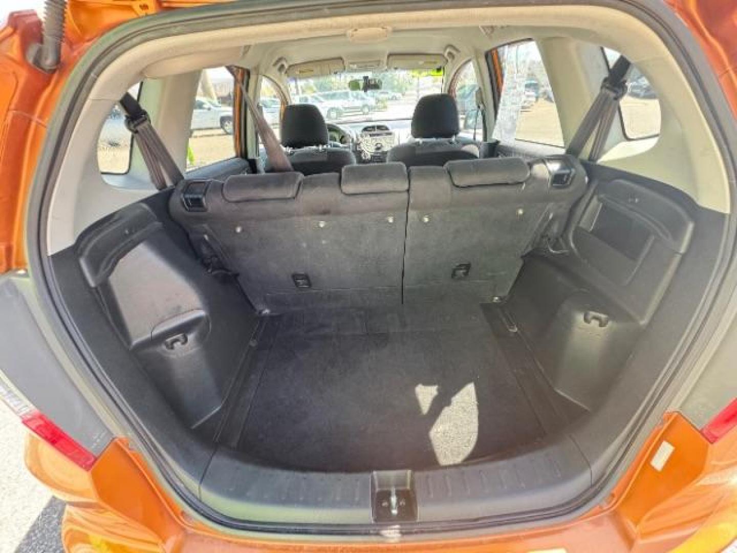 2009 Orange Revolution Me /Black Cloth Interior Honda Fit Sport 5-Speed AT (JHMGE88409S) with an 1.5L L4 SOHC 16V engine, 5-Speed Automatic transmission, located at 1865 East Red Hills Pkwy, St. George, 84770, (435) 628-0023, 37.120850, -113.543640 - Photo#26