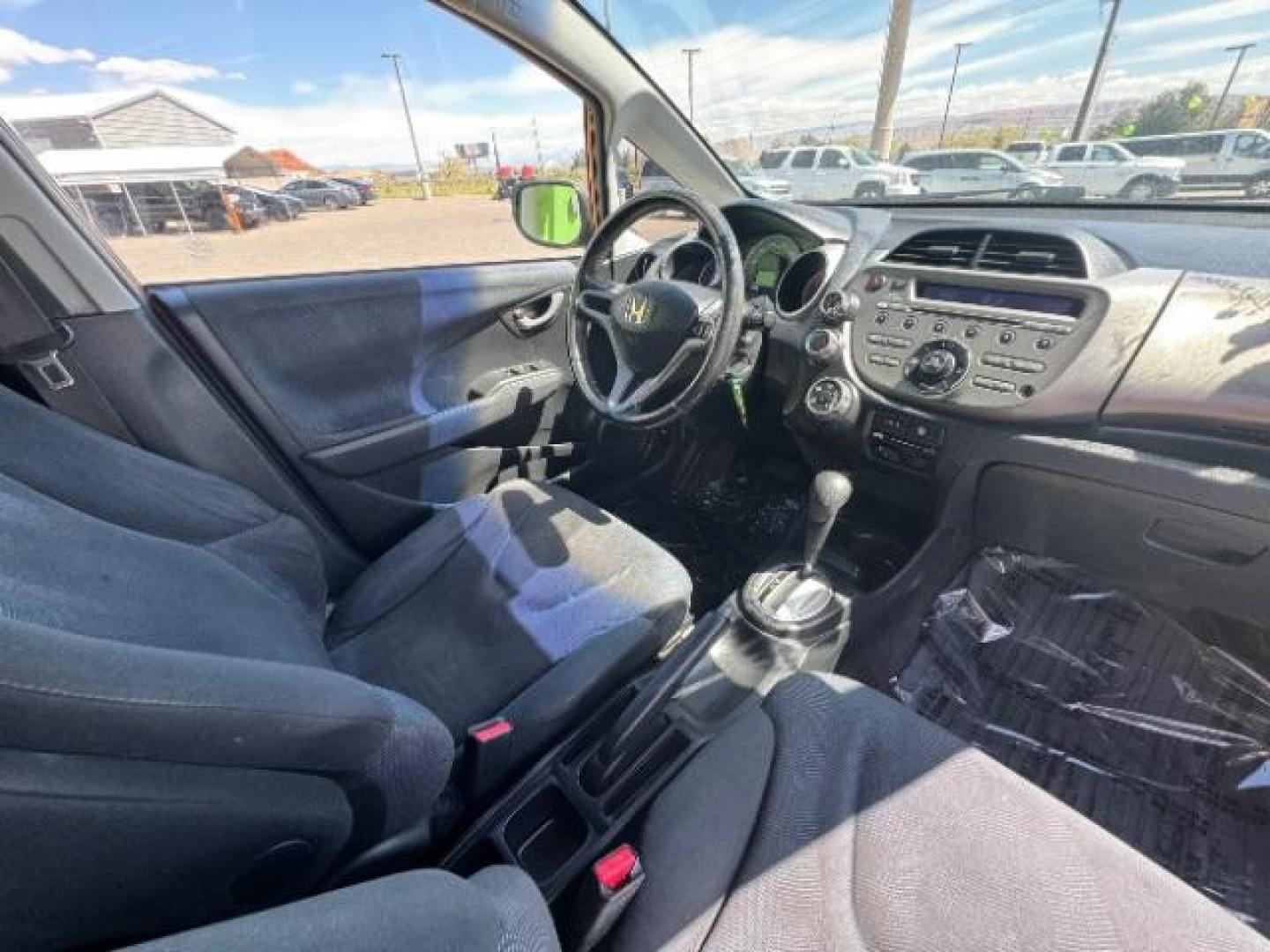 2009 Orange Revolution Me /Black Cloth Interior Honda Fit Sport 5-Speed AT (JHMGE88409S) with an 1.5L L4 SOHC 16V engine, 5-Speed Automatic transmission, located at 1865 East Red Hills Pkwy, St. George, 84770, (435) 628-0023, 37.120850, -113.543640 - Photo#30