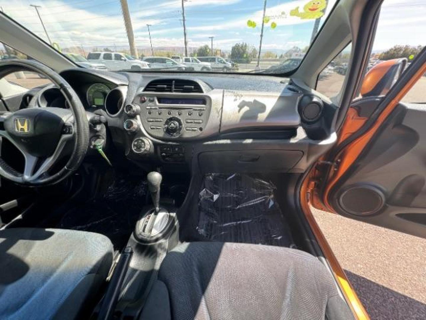 2009 Orange Revolution Me /Black Cloth Interior Honda Fit Sport 5-Speed AT (JHMGE88409S) with an 1.5L L4 SOHC 16V engine, 5-Speed Automatic transmission, located at 1865 East Red Hills Pkwy, St. George, 84770, (435) 628-0023, 37.120850, -113.543640 - Photo#31