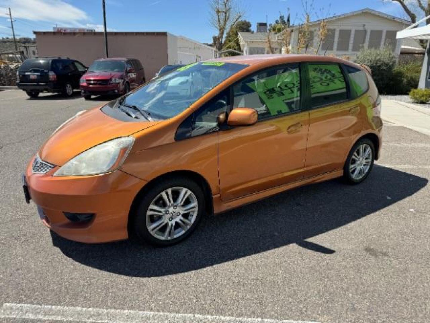 2009 Orange Revolution Me /Black Cloth Interior Honda Fit Sport 5-Speed AT (JHMGE88409S) with an 1.5L L4 SOHC 16V engine, 5-Speed Automatic transmission, located at 1865 East Red Hills Pkwy, St. George, 84770, (435) 628-0023, 37.120850, -113.543640 - Photo#4