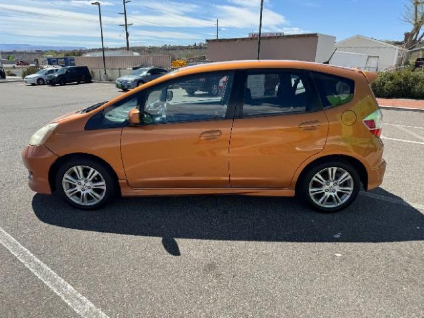 2009 Orange Revolution Me /Black Cloth Interior Honda Fit Sport 5-Speed AT (JHMGE88409S) with an 1.5L L4 SOHC 16V engine, 5-Speed Automatic transmission, located at 1865 East Red Hills Pkwy, St. George, 84770, (435) 628-0023, 37.120850, -113.543640 - Photo#5