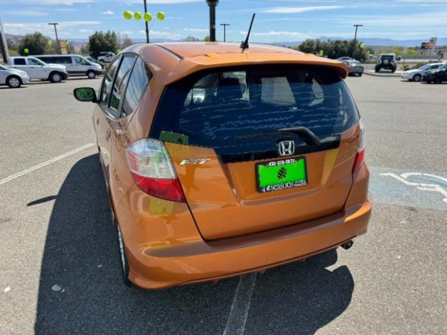 2009 Orange Revolution Me /Black Cloth Interior Honda Fit Sport 5-Speed AT (JHMGE88409S) with an 1.5L L4 SOHC 16V engine, 5-Speed Automatic transmission, located at 1865 East Red Hills Pkwy, St. George, 84770, (435) 628-0023, 37.120850, -113.543640 - Photo#6