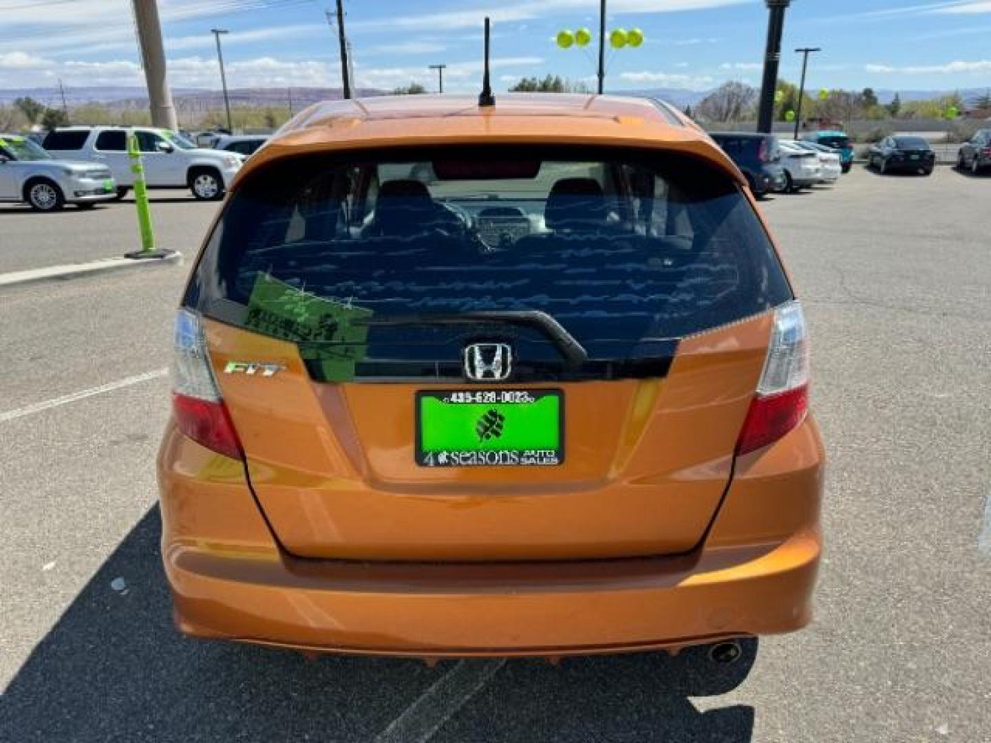 2009 Orange Revolution Me /Black Cloth Interior Honda Fit Sport 5-Speed AT (JHMGE88409S) with an 1.5L L4 SOHC 16V engine, 5-Speed Automatic transmission, located at 1865 East Red Hills Pkwy, St. George, 84770, (435) 628-0023, 37.120850, -113.543640 - Photo#8