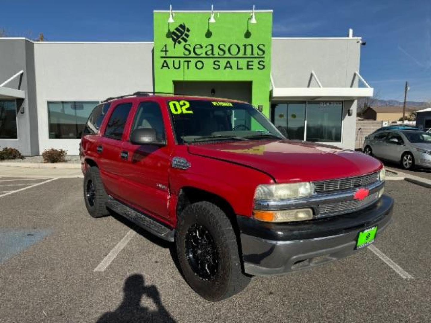 2002 Victory Red /Tan/Neutral Custom C Chevrolet Tahoe 2WD (1GNEC13VX2R) with an 4.8L V8 OHV 16V engine, 4-Speed Automatic transmission, located at 940 North Main Street, Cedar City, UT, 84720, (435) 628-0023, 37.692936, -113.061897 - Photo#0