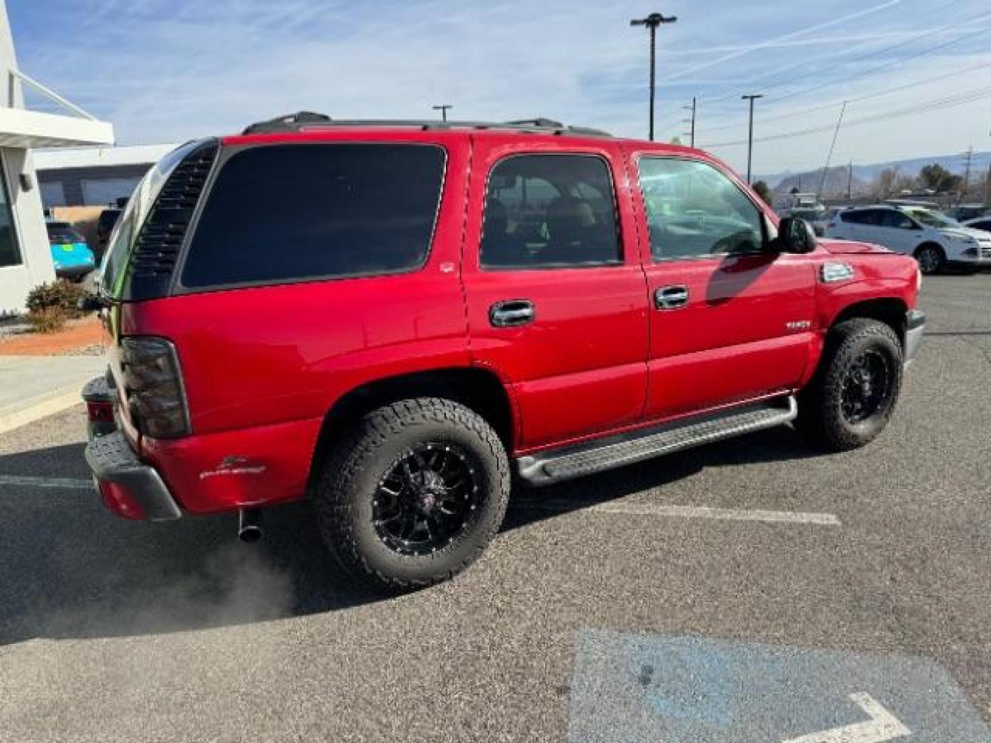 2002 Victory Red /Tan/Neutral Custom C Chevrolet Tahoe 2WD (1GNEC13VX2R) with an 4.8L V8 OHV 16V engine, 4-Speed Automatic transmission, located at 940 North Main Street, Cedar City, UT, 84720, (435) 628-0023, 37.692936, -113.061897 - Photo#10