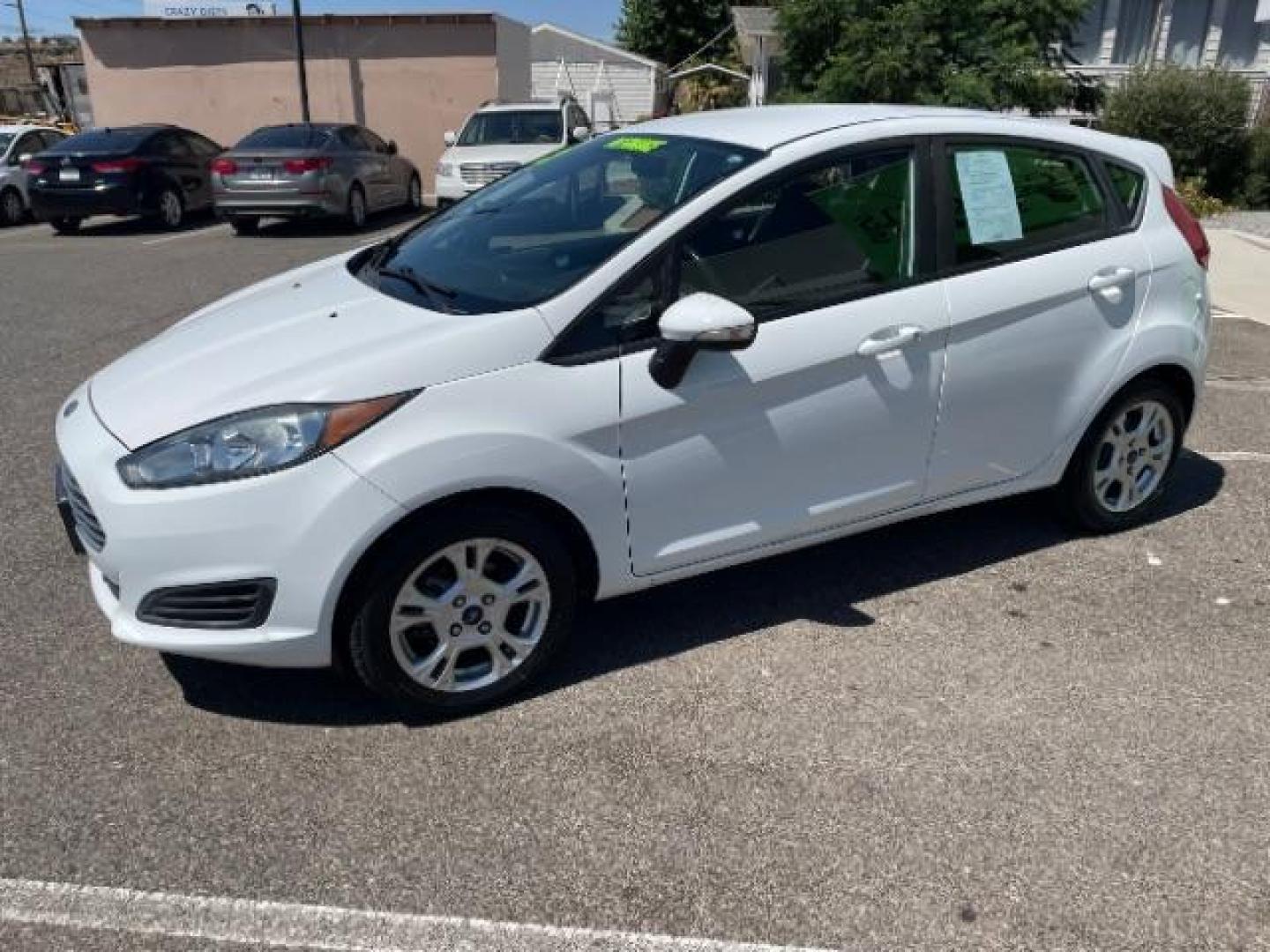 2015 Oxford White /Charcoal Black Ford Fiesta SE Hatchback (3FADP4EJ4FM) with an 1.6L L4 DOHC 16V engine, 6-Speed Automatic transmission, located at 1865 East Red Hills Pkwy, St. George, 84770, (435) 628-0023, 37.120850, -113.543640 - Photo#4