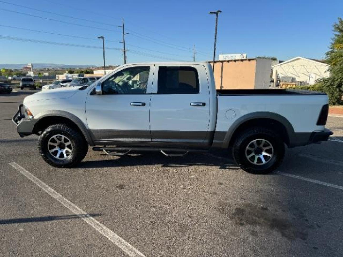 2012 Bright White /Dark Slate Leather Interior RAM 1500 Laramie Crew Cab 4WD (1C6RD7NTXCS) with an 5.7L V8 OHV 16V engine, 6-Speed Automatic transmission, located at 1865 East Red Hills Pkwy, St. George, 84770, (435) 628-0023, 37.120850, -113.543640 - Photo#6