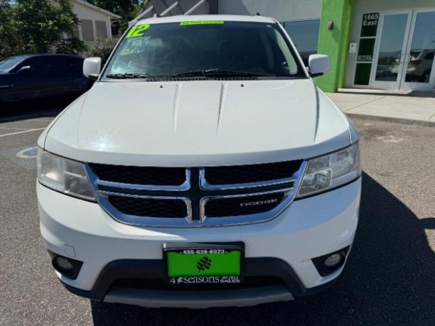 2012 White /Black Cloth Interior Dodge Journey SXT (3C4PDCBG9CT) with an 3.6L V6 DOHC 24V engine, 6-Speed Automatic transmission, located at 940 North Main Street, Cedar City, UT, 84720, (435) 628-0023, 37.692936, -113.061897 - Photo#2