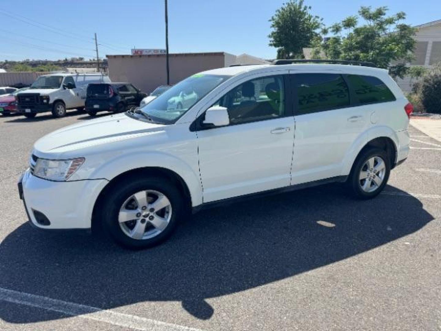 2012 White /Black Cloth Interior Dodge Journey SXT (3C4PDCBG9CT) with an 3.6L V6 DOHC 24V engine, 6-Speed Automatic transmission, located at 940 North Main Street, Cedar City, UT, 84720, (435) 628-0023, 37.692936, -113.061897 - Photo#4